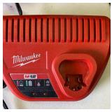 Milwaukee lot- Untested AS IS - LED Work light,  battery charger, saw blades and carry case