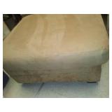 Armless lounging chair with pillow.