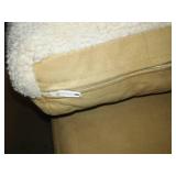 Armless lounging chair with pillow.