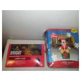 Mickey Mouse inflatable with Christmas laser lights.