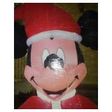Mickey Mouse inflatable with Christmas laser lights.