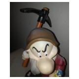 Grumpy flowerpot and solar statue.