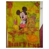 Tote and cover full of garden banners and flags.