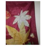 Tote and cover full of garden banners and flags.