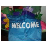 Tote and cover full of garden banners and flags.