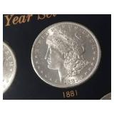 DATE SET OF 27 AU-BU MORGAN SILVER DOLLARS IN CAPITAL HOLDER