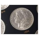 DATE SET OF 27 AU-BU MORGAN SILVER DOLLARS IN CAPITAL HOLDER