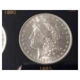 DATE SET OF 27 AU-BU MORGAN SILVER DOLLARS IN CAPITAL HOLDER