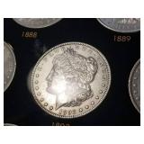 DATE SET OF 27 AU-BU MORGAN SILVER DOLLARS IN CAPITAL HOLDER