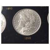 DATE SET OF 27 AU-BU MORGAN SILVER DOLLARS IN CAPITAL HOLDER