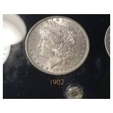 DATE SET OF 27 AU-BU MORGAN SILVER DOLLARS IN CAPITAL HOLDER