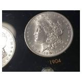 DATE SET OF 27 AU-BU MORGAN SILVER DOLLARS IN CAPITAL HOLDER