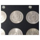 DATE SET OF 27 AU-BU MORGAN SILVER DOLLARS IN CAPITAL HOLDER