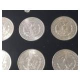 DATE SET OF 27 AU-BU MORGAN SILVER DOLLARS IN CAPITAL HOLDER