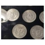 DATE SET OF 27 AU-BU MORGAN SILVER DOLLARS IN CAPITAL HOLDER