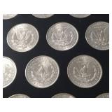DATE SET OF 27 AU-BU MORGAN SILVER DOLLARS IN CAPITAL HOLDER