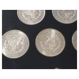 DATE SET OF 27 AU-BU MORGAN SILVER DOLLARS IN CAPITAL HOLDER