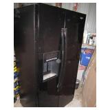 Whirlpool side by side refrigerator...