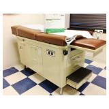 MSRP $1200 Super Nice FAMILY PRACTICE OB/GYN MEDICAL VETERINARIAN TREATMENT EXAMINATION TABLE WITH STEP UP STOOLS, TUCKAWAY STIRRUPS, STORAGE DRAWERS & 1 DOOR CABINET ALSO INCLUDES EXTRA PAPER ROL