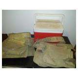 2 leather tool belts and cooler.