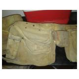2 leather tool belts and cooler.
