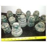 12 green glass insulators
