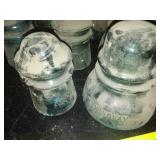 12 green glass insulators