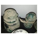 12 green glass insulators