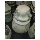 12 green glass insulators