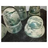 12 green glass insulators