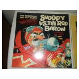 Two albums - snoopy versus the Red Baron and men in the Green Beret