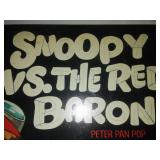 Two albums - snoopy versus the Red Baron and men in the Green Beret