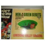 Two albums - snoopy versus the Red Baron and men in the Green Beret