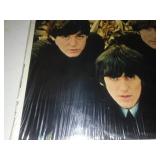 The early Beatles album with cellophane and price tag near mint condition.