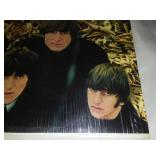 The early Beatles album with cellophane and price tag near mint condition.