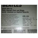 The early Beatles album with cellophane and price tag near mint condition.