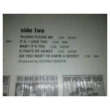 The early Beatles album with cellophane and price tag near mint condition.