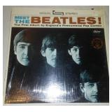 Meet The Beatles album with cellophane and price take. Near mint condition.