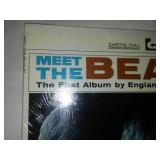 Meet The Beatles album with cellophane and price take. Near mint condition.