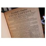 Vintage Library edition of books with Iron ship book end