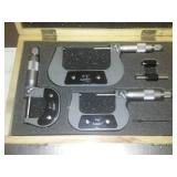 3 micrometers set in wood case.