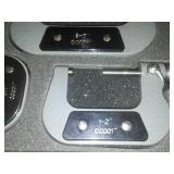 3 micrometers set in wood case.