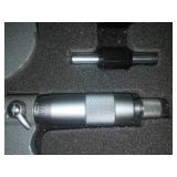 3 micrometers set in wood case.