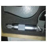 3 micrometers set in wood case.