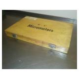 3 micrometers set in wood case.