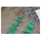 Lot of (58) Industrial Roller Hardware  with Pole Mounting Bracket (x23), PVC Spacer 2-1/2"Dx1-1/2"W (x32), J Hook Unit 10" with Nut (in package x3), Misc. Mounts and Hardware