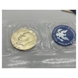 Two 1974 Uncirculated Eisenhower Silver Dollars