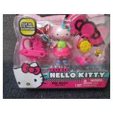 4 Hello Kitty Mini Dolls...
