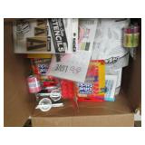 box of mostly packages of glue stic...