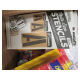 box of mostly packages of glue stic...
